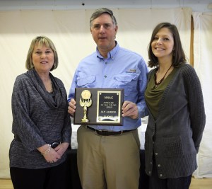 Jan Jamrog receiving the 2012 "NNAC Angler of the Year" award from The Chesapeake Angler publishers Karen Jett and Laura Brady Kelley